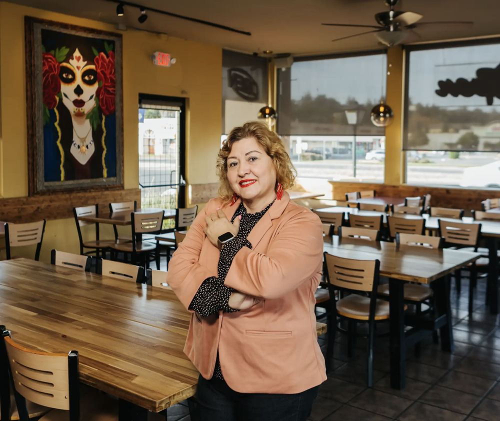 Martha Rubio, founder of Tacos Jalisco, standing in the dining room on Sonoma Blvd